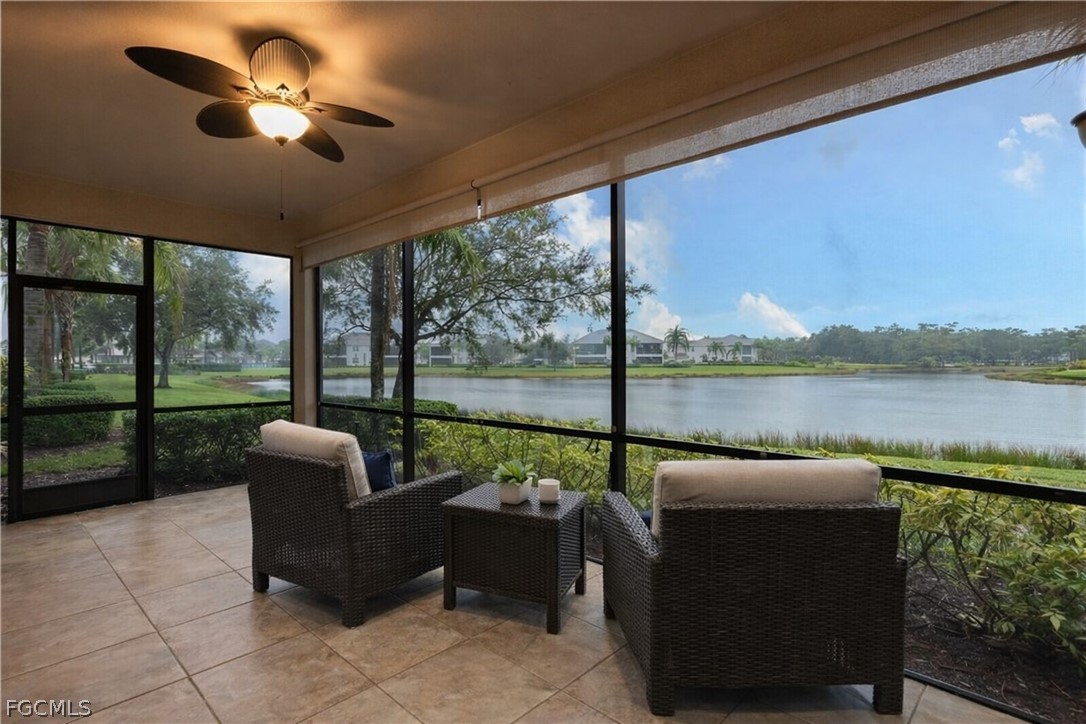 13110 Pebblebrook Point Circle, Unit 102 Fort Myers, FL 33905 - Photo 19 of 35 a balcony with furniture and a floor to ceiling window