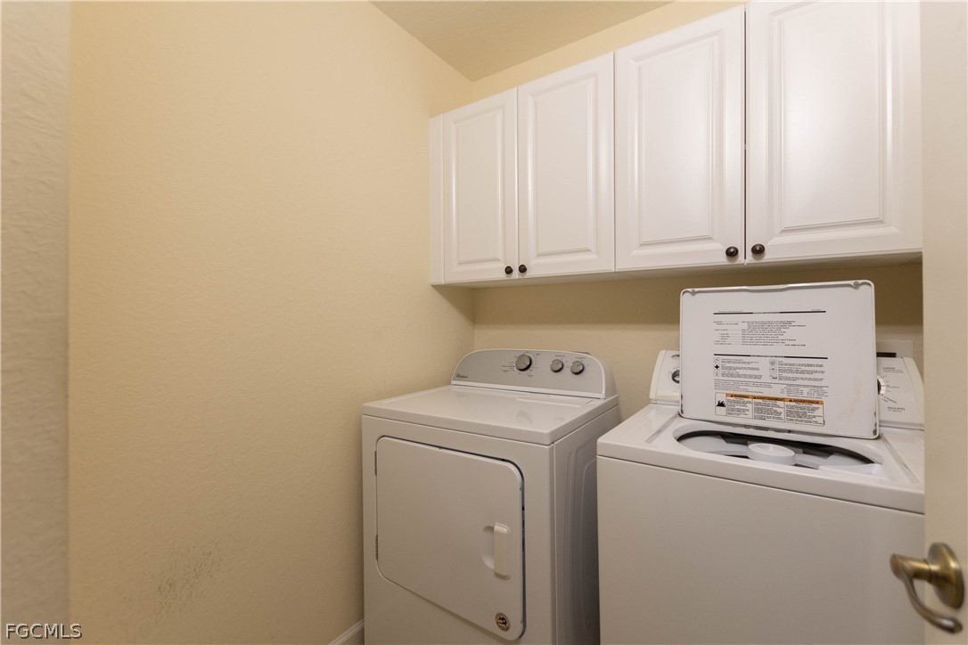 13110 Pebblebrook Point Circle, Unit 102 Fort Myers, FL 33905 - Photo 20 of 35 a view of storage and utility room with washer and dryer