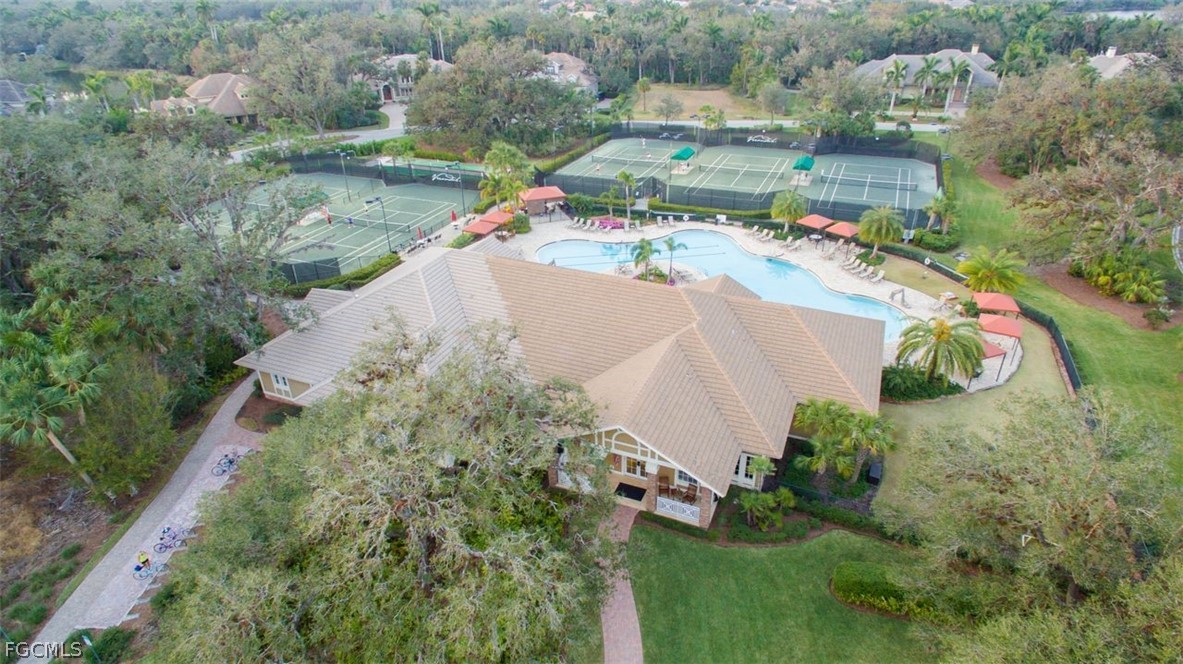 13110 Pebblebrook Point Circle, Unit 102 Fort Myers, FL 33905 - Photo 28 of 35 an aerial view of a house with a yard and lake