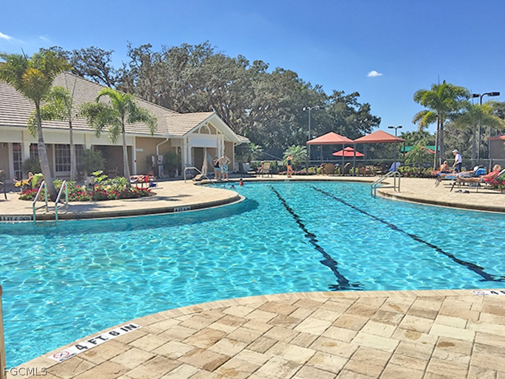 13110 Pebblebrook Point Circle, Unit 102 Fort Myers, FL 33905 - Photo 30 of 35 a backyard of a house with table and chairs