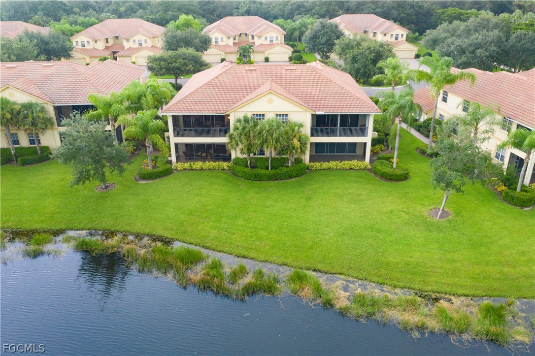 13110 Pebblebrook Point Circle, Unit 102 Fort Myers, FL 33905 - Photo 3 of 35 a front view of a house with garden