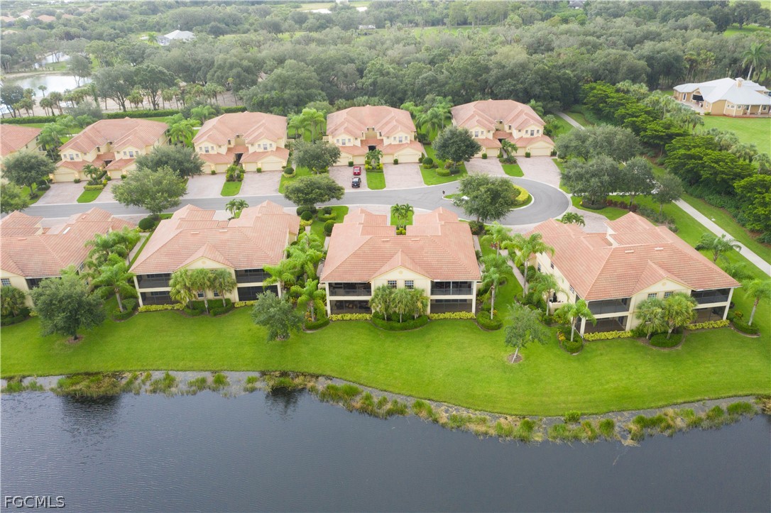 13110 Pebblebrook Point Circle, Unit 102 Fort Myers, FL 33905 - Photo 4 of 35 an aerial view of a house with yard and lake view in back