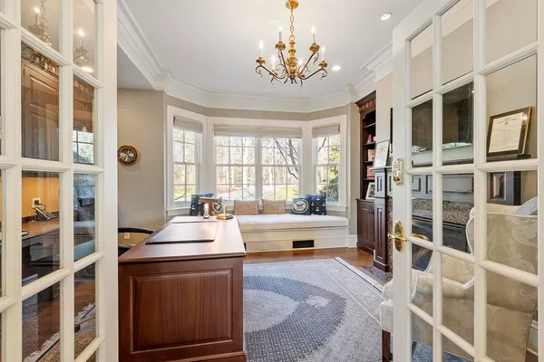 a room with pool table and windows