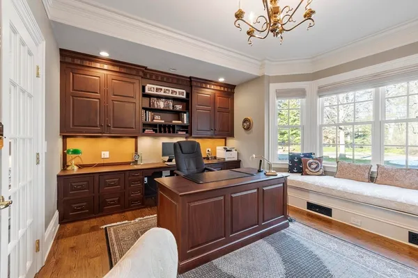 a very nice looking room with a large window and a chandelier