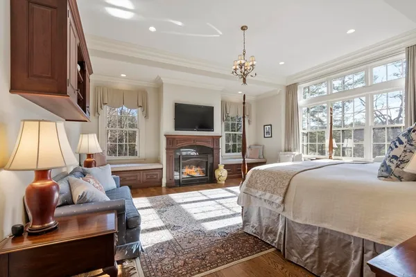 a bedroom with a bed and a fireplace