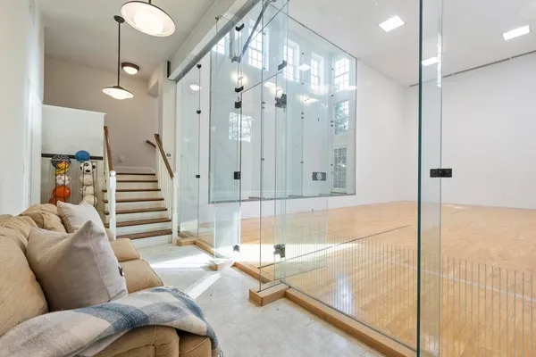 a living room with furniture and a chandelier