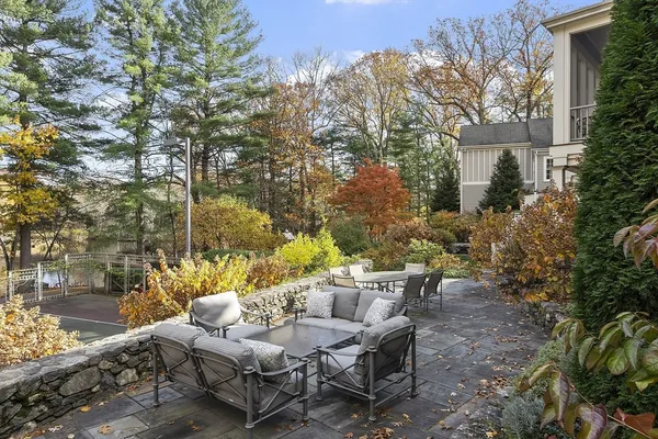 a view of a patio with furniture and a yard