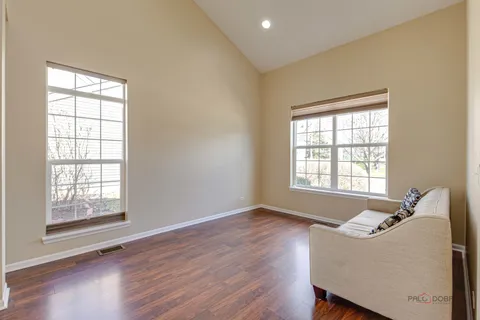 a view of a dining room with furniture and window