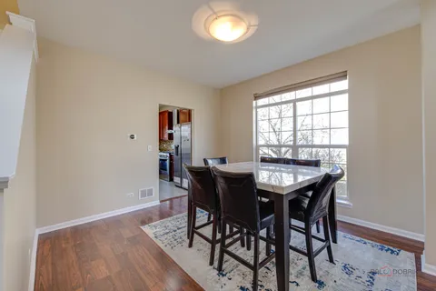 a kitchen with stainless steel appliances granite countertop a stove and a refrigerator