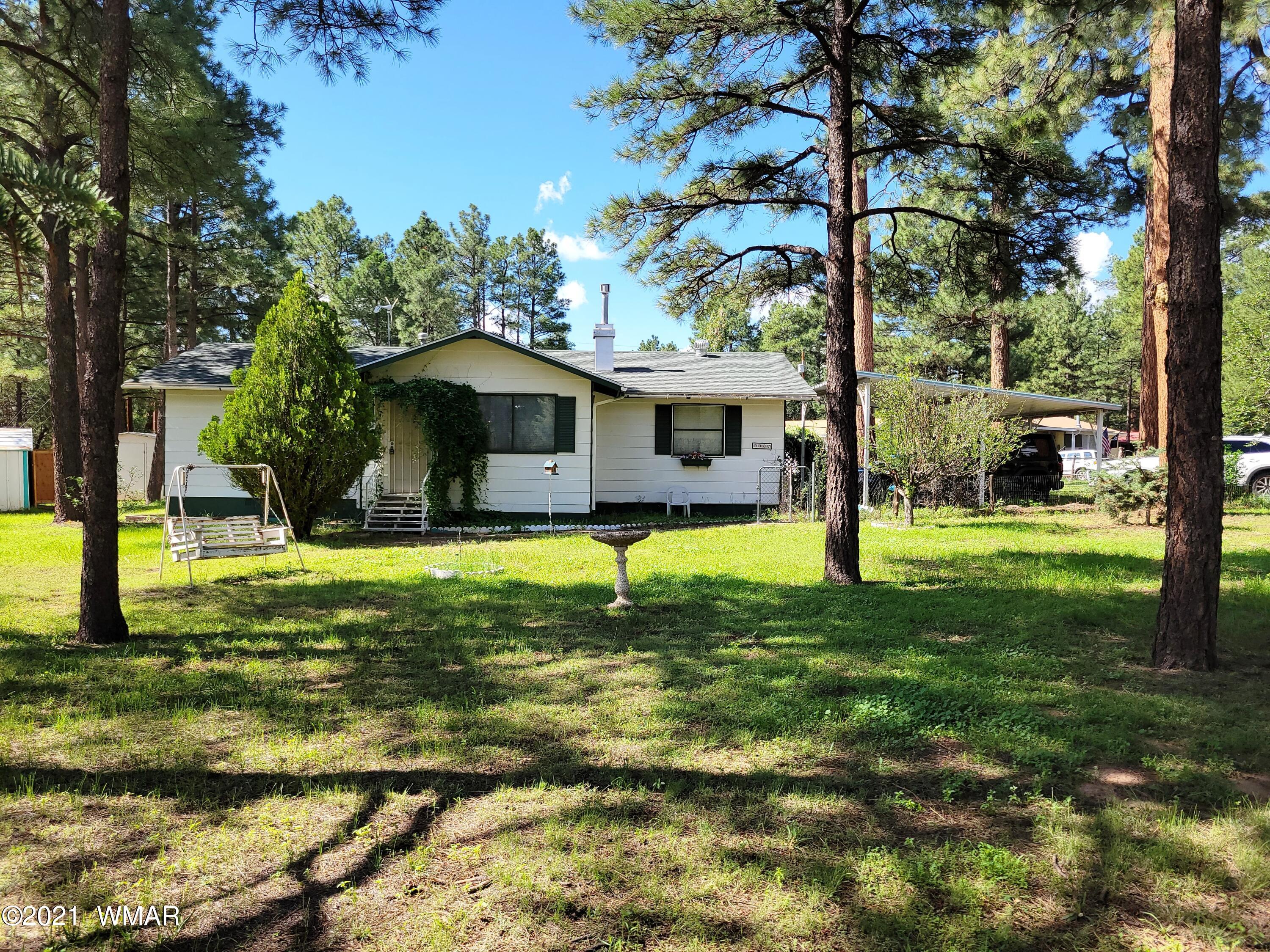 2037 Lumber Valley Road Overgaard, AZ 85933 - Photo 1 of 23 a view of a house with a yard
