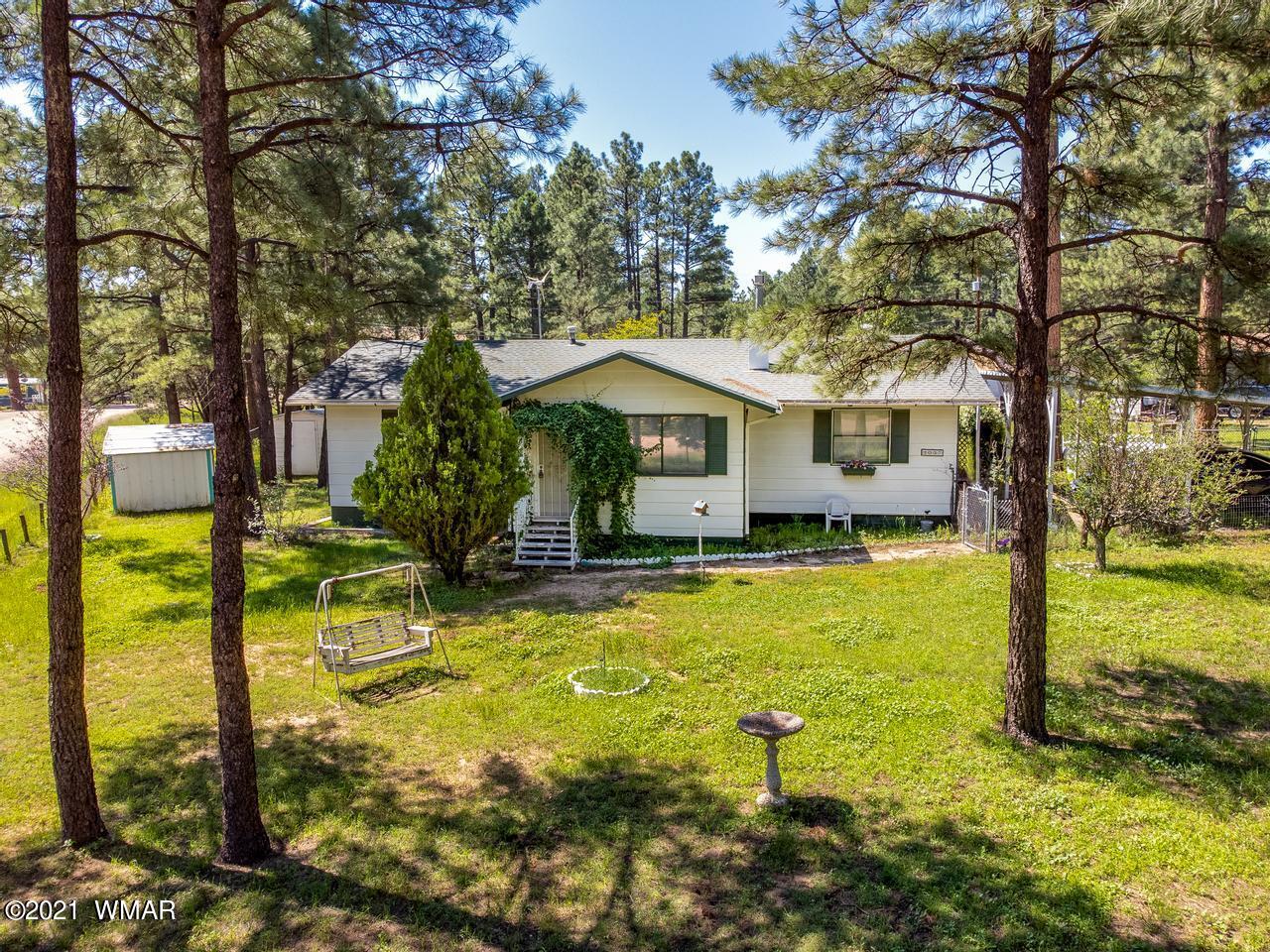 2037 Lumber Valley Road Overgaard, AZ 85933 - Photo 3 of 23 a view of a house with pool and tree s