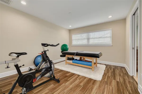 a living room with furniture a rug and a window