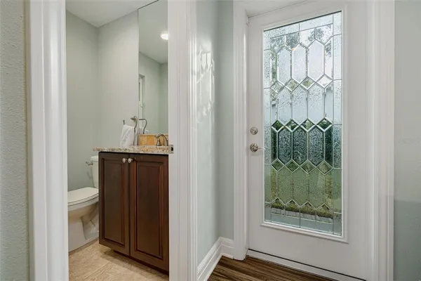 a view of a closet and mirror