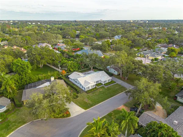 an aerial view of a house with a yard