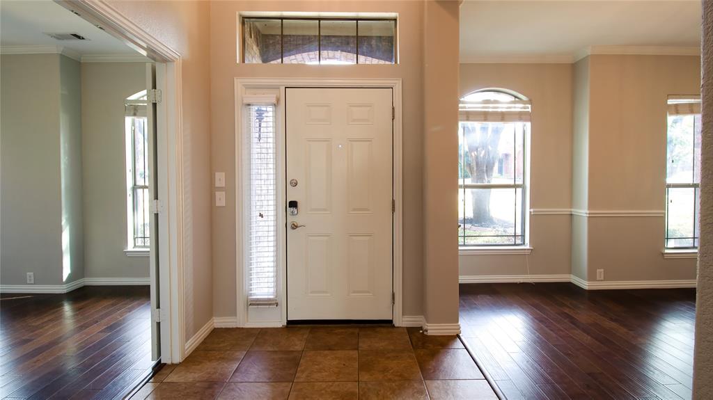 8698 Fisher Road Frisco, TX 75033 - Photo 4 of 33 an empty room with wooden floor and windows