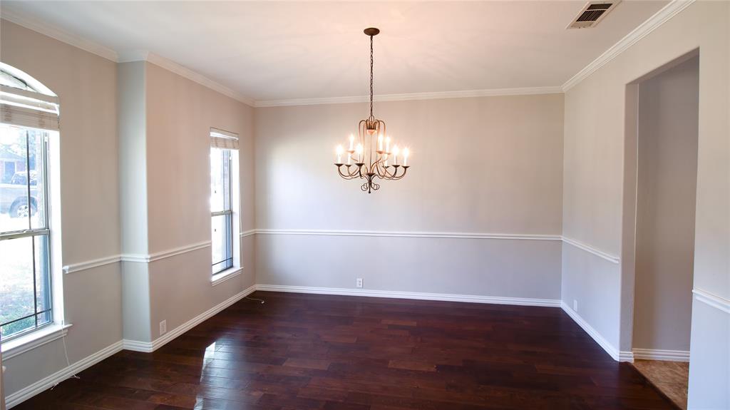 8698 Fisher Road Frisco, TX 75033 - Photo 7 of 33 a view of a room with wooden floor and windows