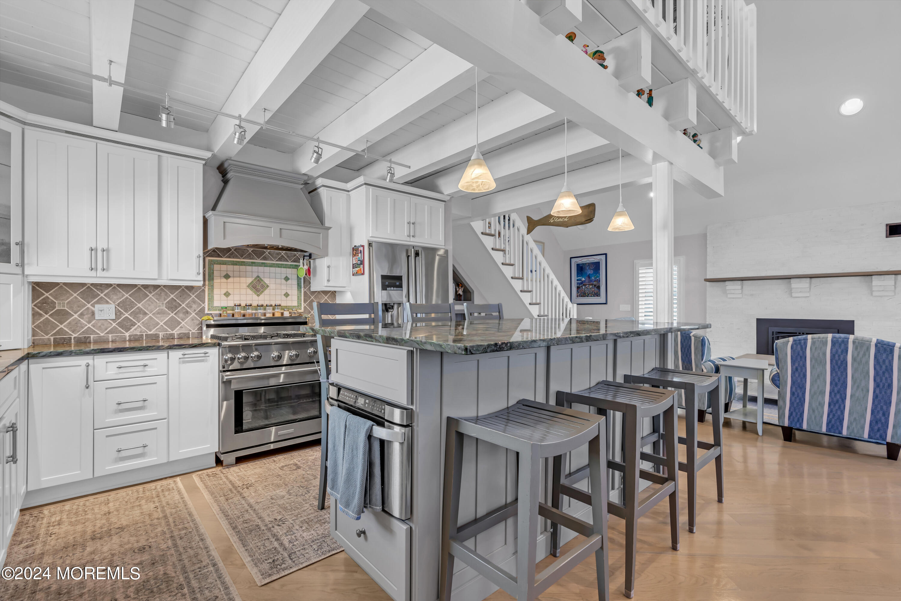 381 Aldo Drive Toms River, NJ 08753 - Photo 14 of 58 a kitchen with stainless steel appliances kitchen island granite countertop a table chairs sink and cabinets