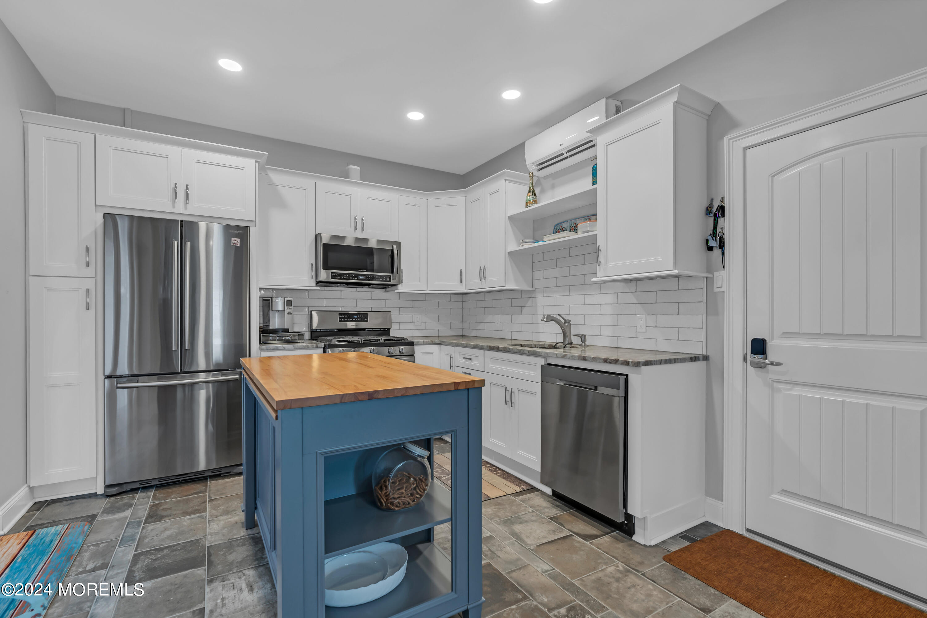 381 Aldo Drive Toms River, NJ 08753 - Photo 30 of 58 a kitchen with stainless steel appliances granite countertop a refrigerator and a stove top oven