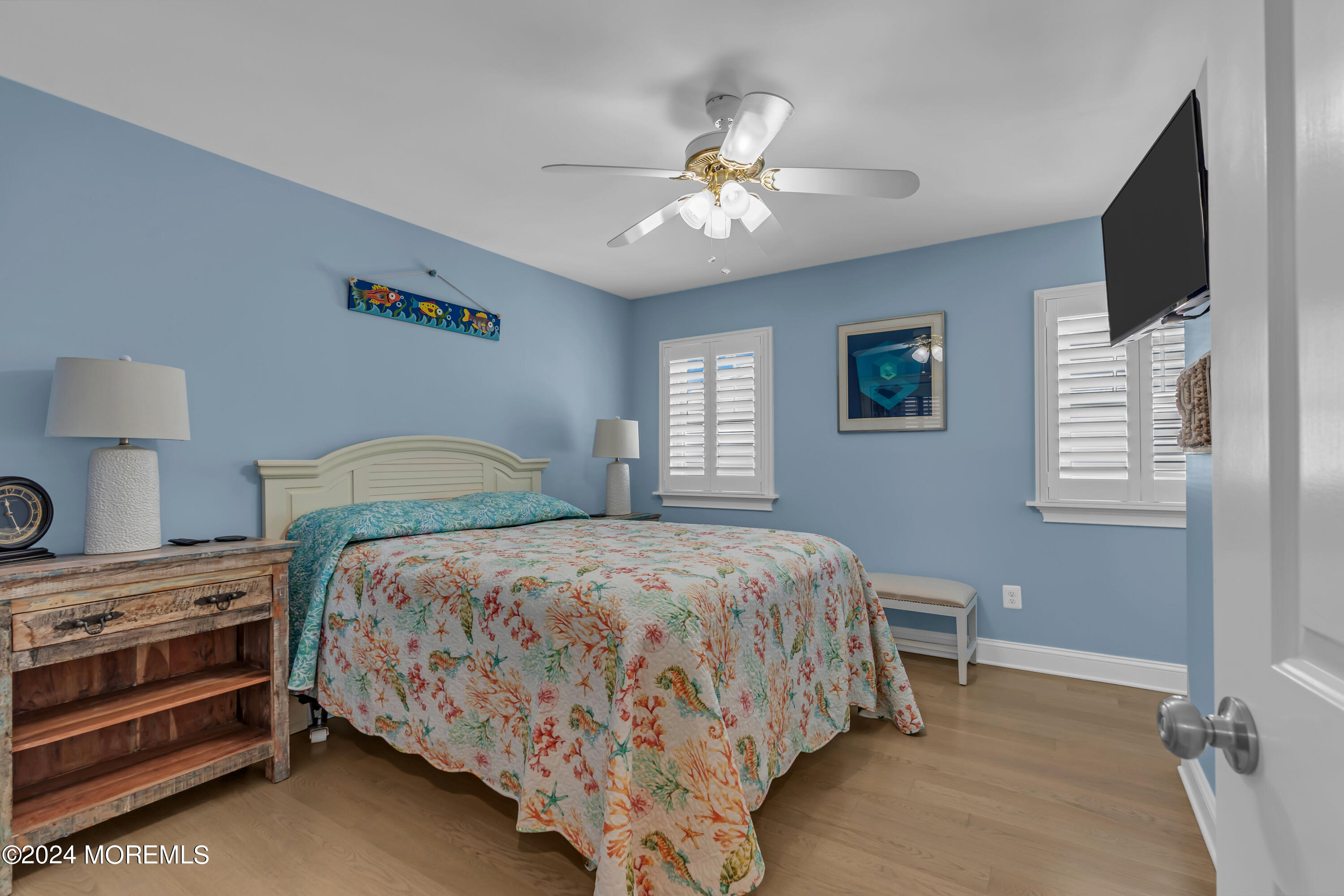 381 Aldo Drive Toms River, NJ 08753 - Photo 31 of 58 a bedroom with a bed and a chandelier