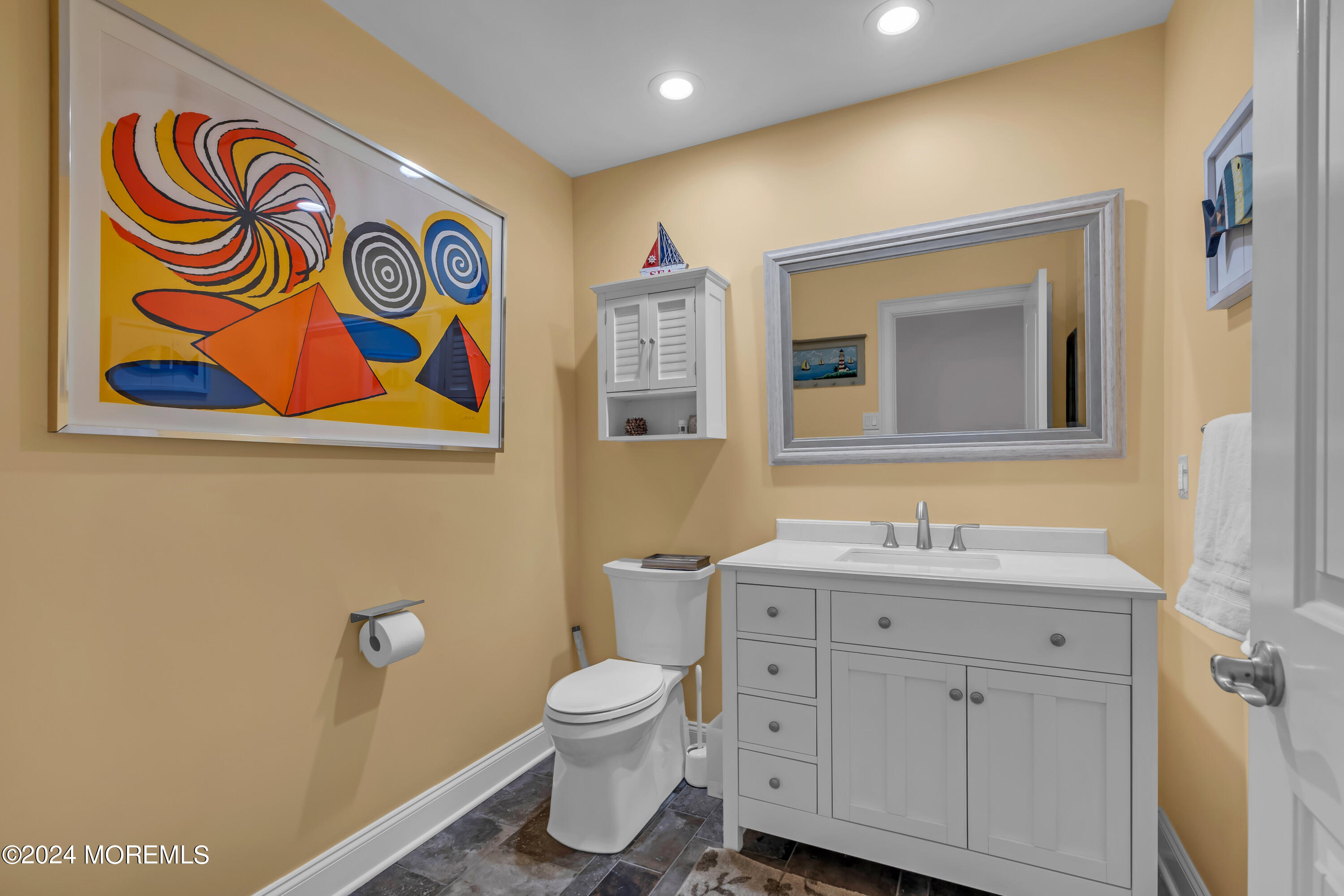 381 Aldo Drive Toms River, NJ 08753 - Photo 34 of 58 a bathroom with a toilet sink and mirror