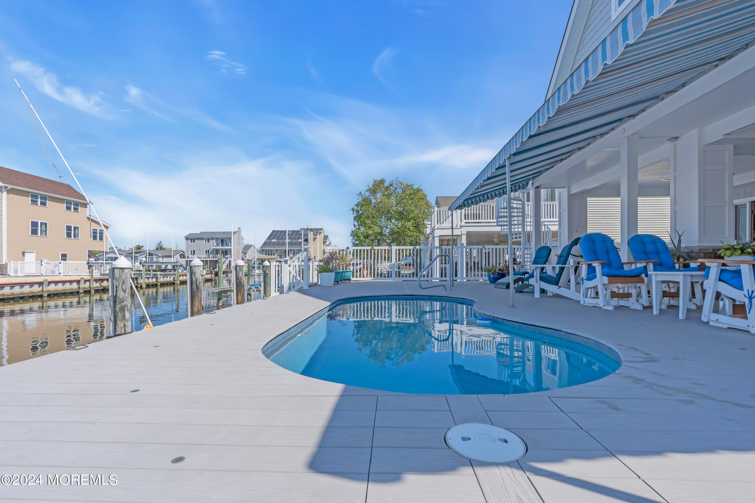 381 Aldo Drive Toms River, NJ 08753 - Photo 50 of 58 a view of a swimming pool with outdoor seating