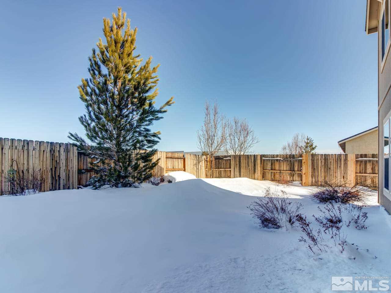 9055 Convair Way Reno, NV 89506 - Photo 23 of 24 a view of a house with a yard
