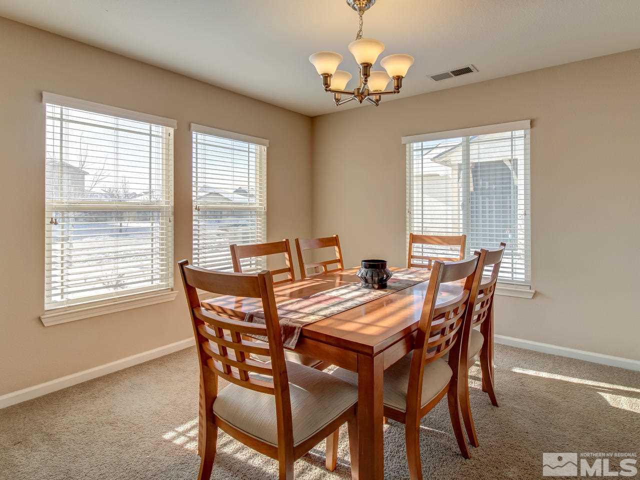 9055 Convair Way Reno, NV 89506 - Photo 8 of 24 a view of a dining room with furniture window and outside view