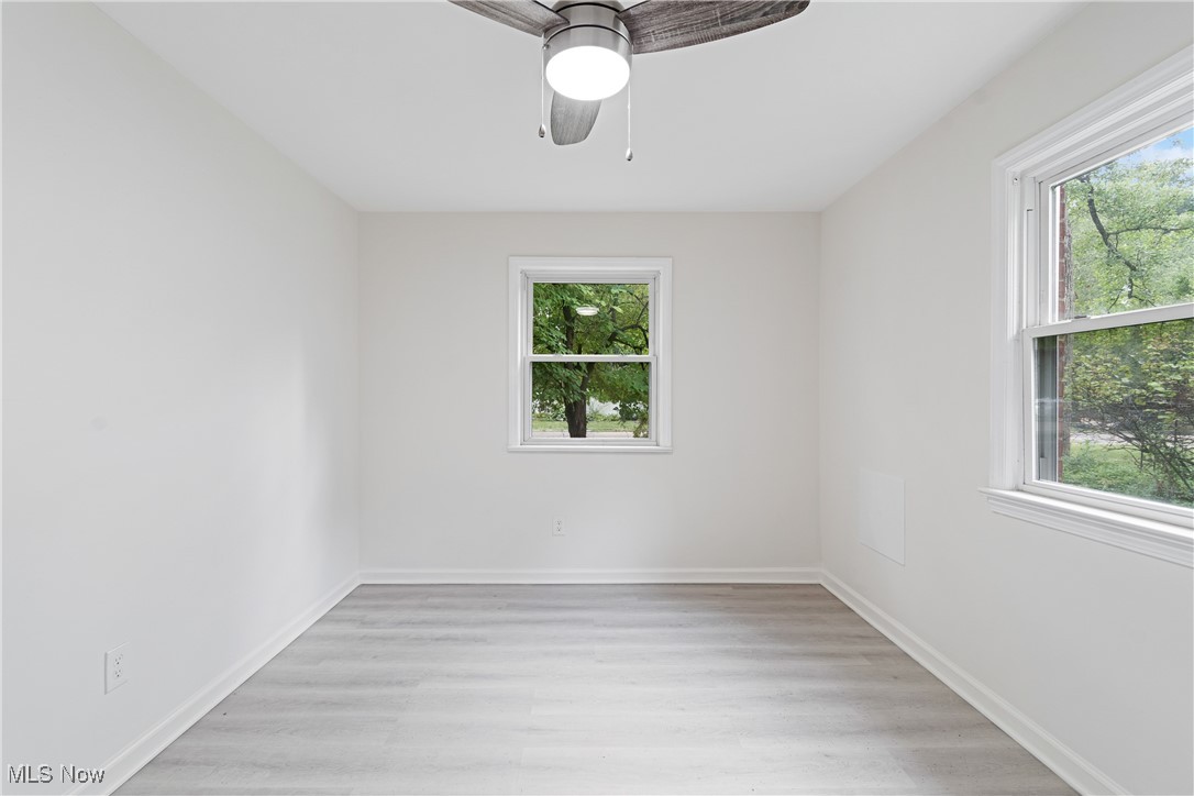 1057 Renfield Road Cleveland Heights, OH 44121 - Photo 18 of 30 Unfurnished room featuring ceiling fan and light hardwood / wood-style floors
