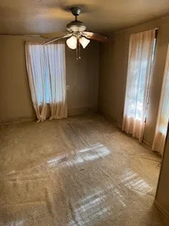 a view of a room with wooden floor and cabinet