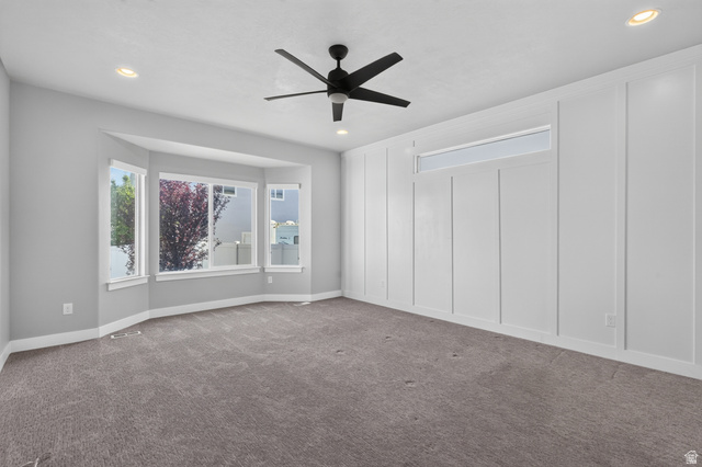 36 West Syracuse Road Vineyard, UT 84059 - Photo 24 of 56 Spacious room featuring gray carpeting and a prominent bay window