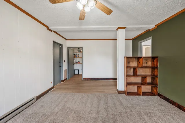 an empty room with shelves