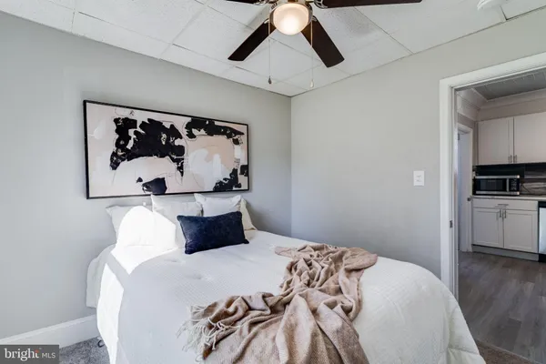 a bathroom with a toilet a sink and a mirror