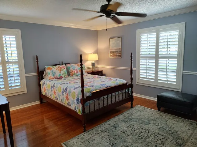 a living room with furniture and a lamp