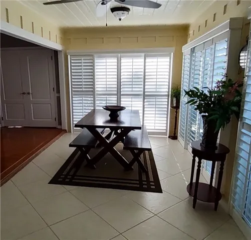 a view of backyard with a tub and seating space