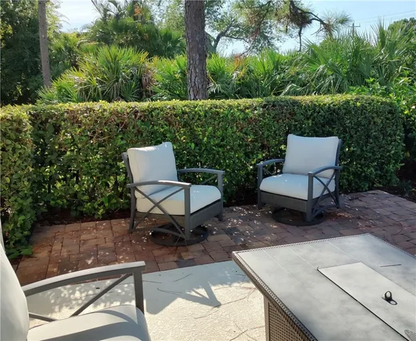 a view of a backyard with furniture