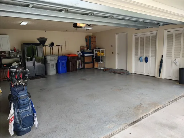 a kitchen with a sink a stove and cabinets