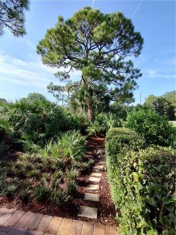 a view of a livingroom with furniture and a mirror