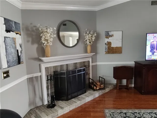 a kitchen with stainless steel appliances granite countertop wooden cabinets a sink and dishwasher