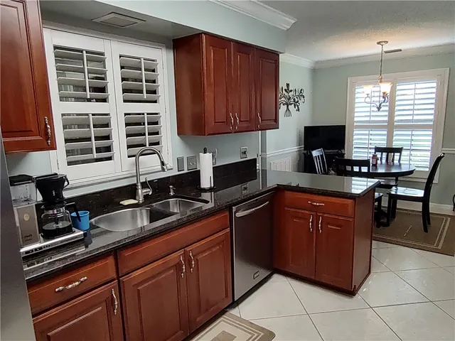a view of a dining room with furniture and window