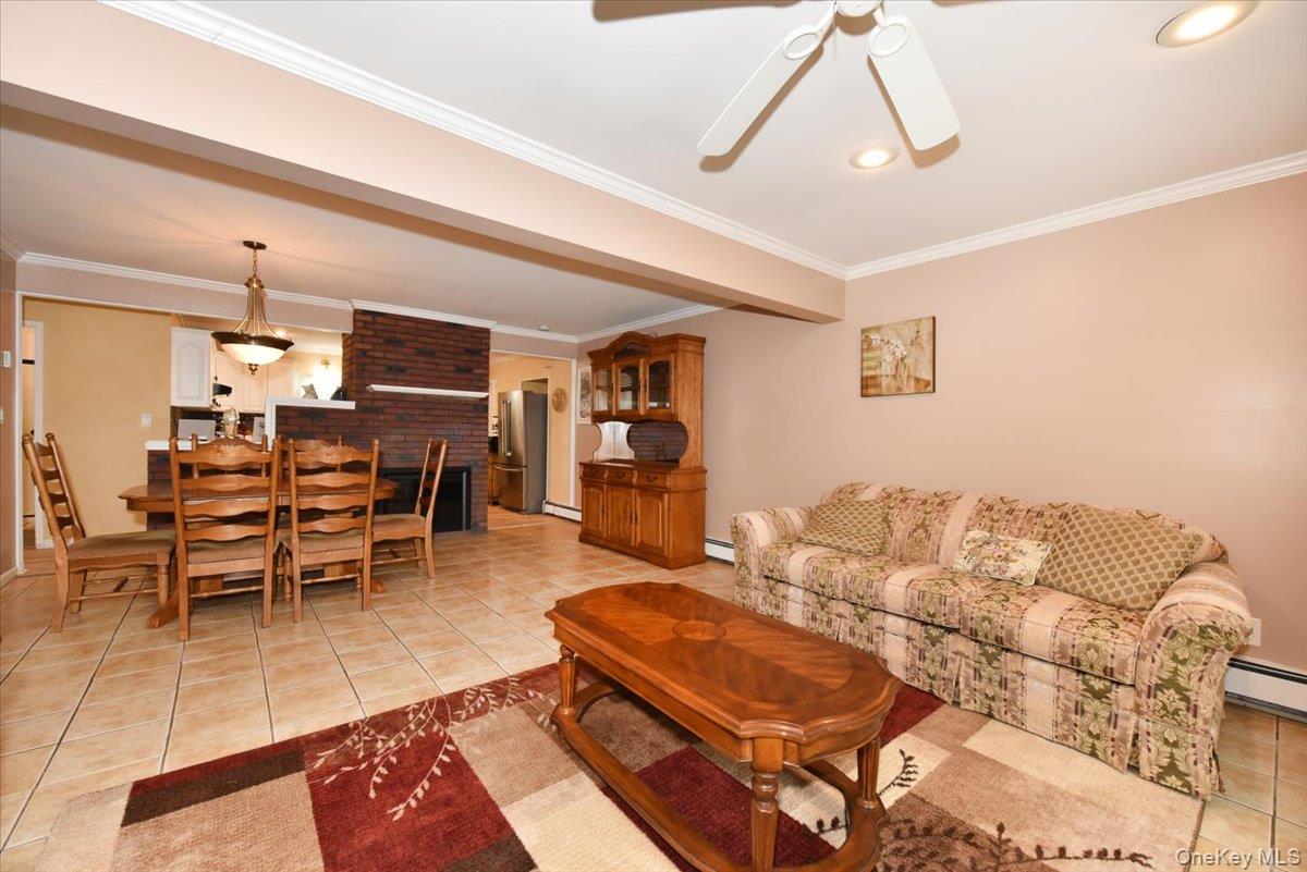 307 Blacksmith Road Levittown, NY 11756 - Photo 7 of 27 a living room with furniture and wooden floor