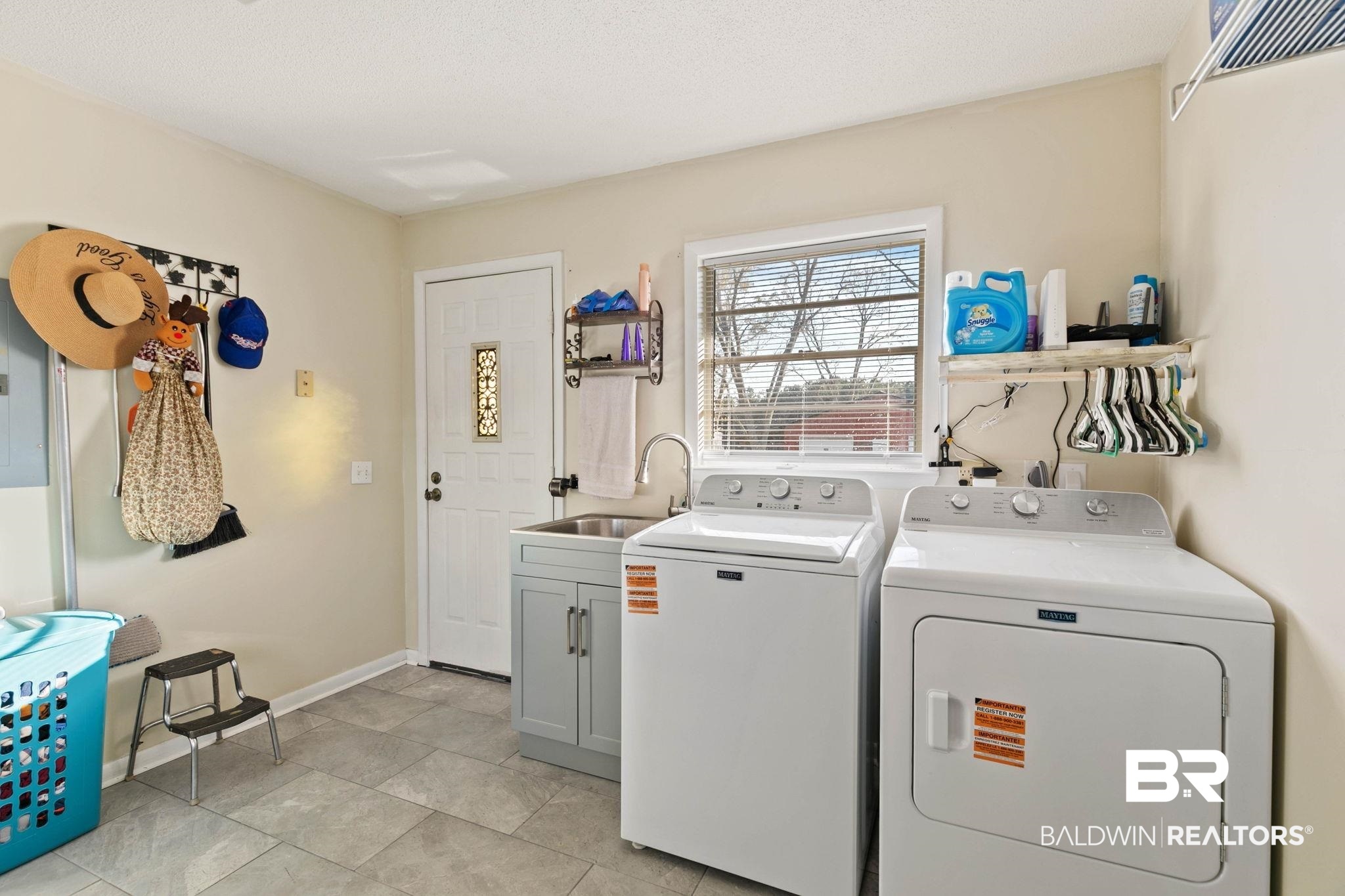 21267 Loop Road Andalusia, AL 36421 - Photo 37 of 72 Laundry room with washing machine and clothes dryer, light tile patterned floors, and electric panel