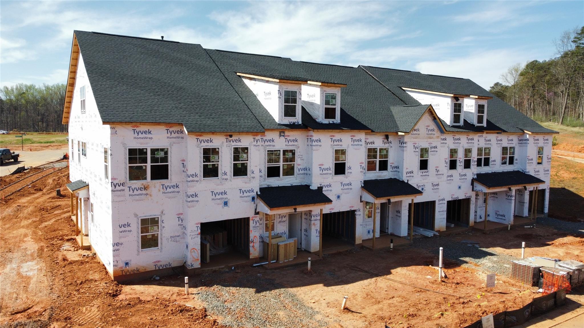 9700 Munsing Drive, Unit 183 Charlotte, NC 28269 - Photo 12 of 18 a front view of a house with a yard