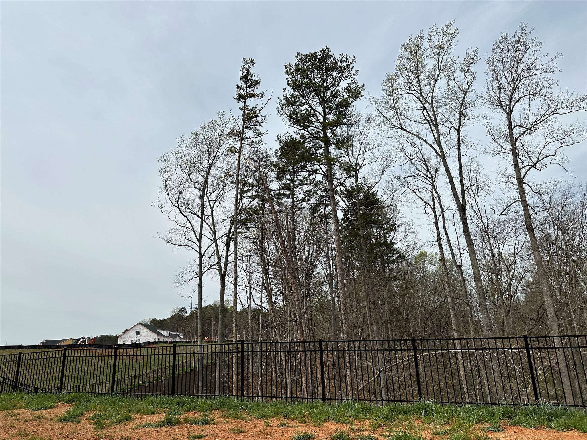 9700 Munsing Drive, Unit 183 Charlotte, NC 28269 - Photo 7 of 18 a view of swimming pool with wooden fence