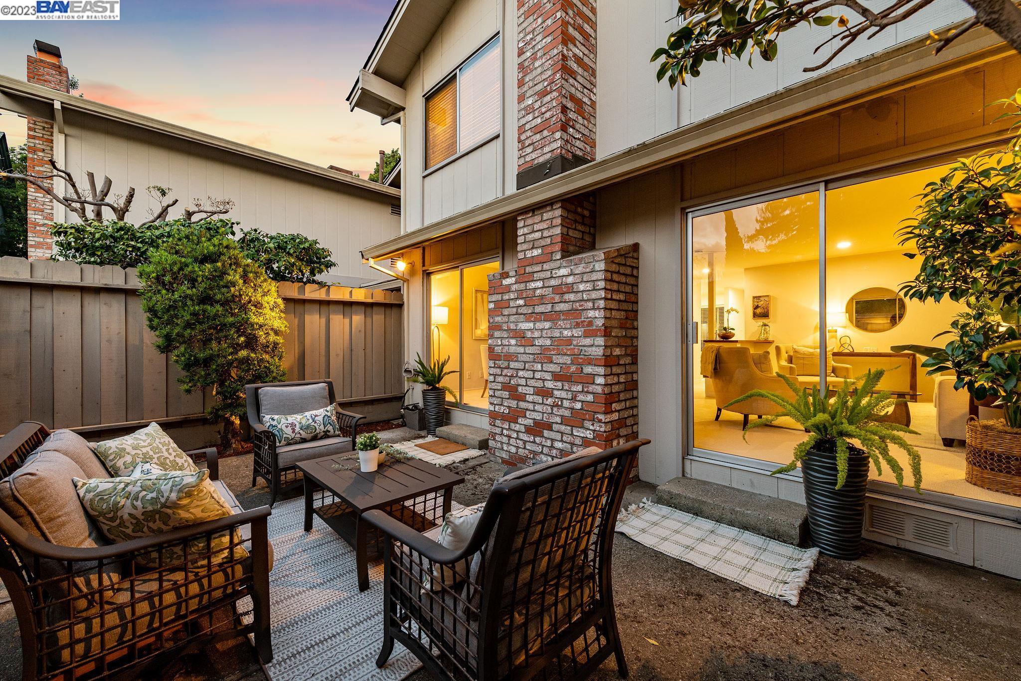1407 Union Street Alameda, CA 94501 - Photo 1 of 1 a backyard of a house with barbeque oven table and chairs