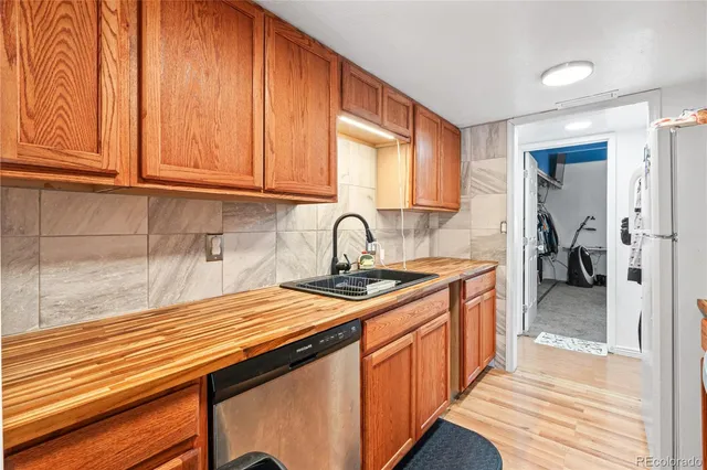 a kitchen with stainless steel appliances granite countertop a sink and cabinets