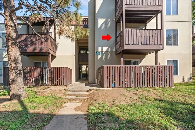 a front view of a house with a fence