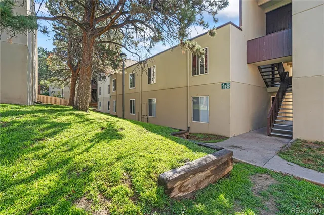 a backyard of a house with seating space