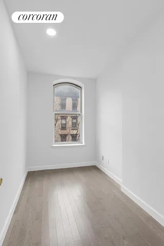a view of kitchen with sink and wooden floor