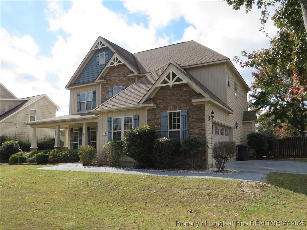 19 Turner Matthew Court Spring Lake, NC 28390 - Photo 1 of 20 a front view of a house with a garden