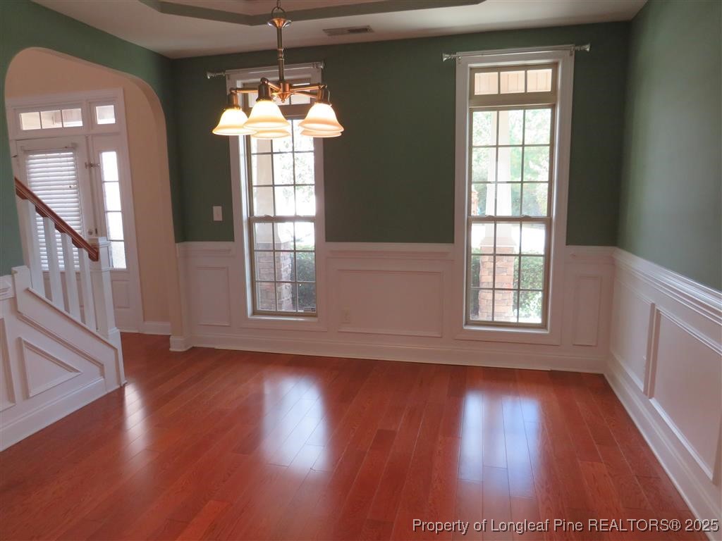 19 Turner Matthew Court Spring Lake, NC 28390 - Photo 11 of 20 an empty room with wooden floor and windows